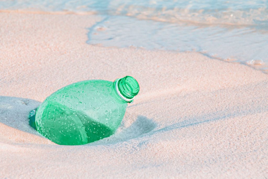 Label-less water bottle with embossed logo on thick plastic